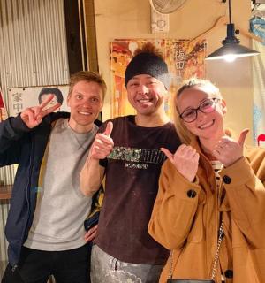 a group of three people giving the thumbs up