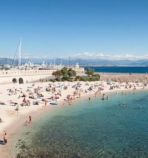 a group of people on a beach in the water