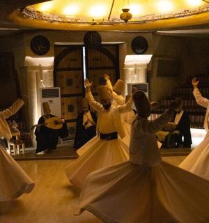a group of women dancing in front of a mirror