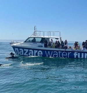 a group of people on a boat in the water