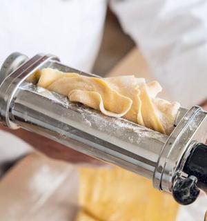 a person is holding a plate of food