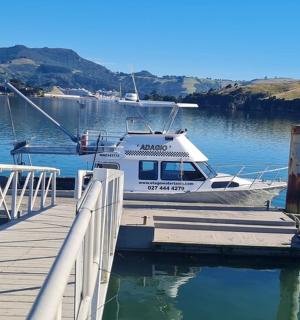 a boat is docked at a dock in the water