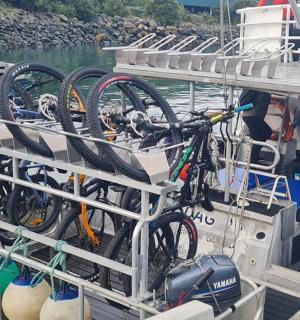 a bunch of bikes on a boat in the water