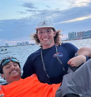 two people on a boat in the water