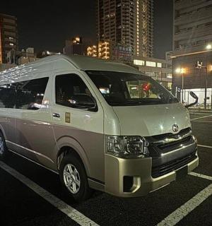 a van parked in a parking lot at night