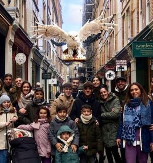 a group of people standing on a city street