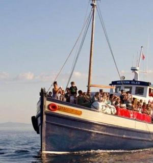 a group of people on a boat in the water