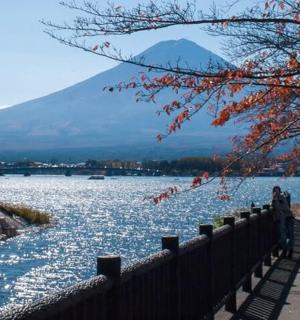 a body of water with a mountain in the background