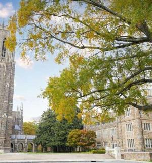 a large building with a tower and a church