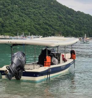 a small boat in the water on a lake
