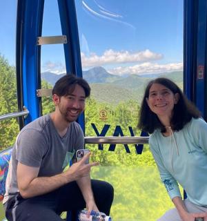 a man and a woman sitting on a bus