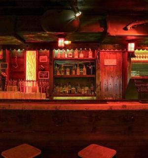 a bar with a lot of alcohol bottles