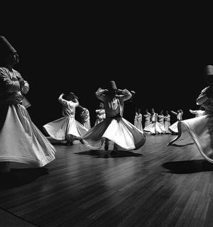 a group of people dancing on a wooden floor