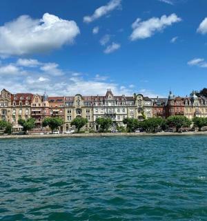 a large building on the shore of a body of water