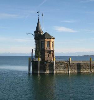 a lighthouse on a pier in the water