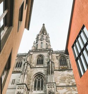an old church with a tower in the distance