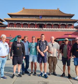 a group of people standing in front of a building