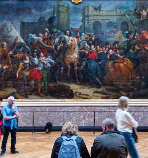 people standing in front of a large painting in a museum