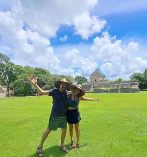 a man and a woman standing in a field