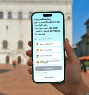 a person holding a cell phone in front of a building