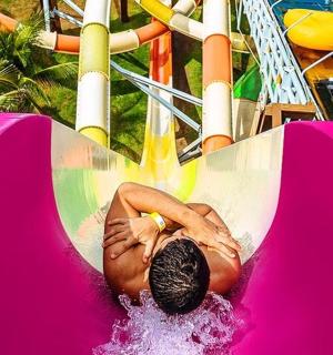 a man is riding on a ride on a roller coaster