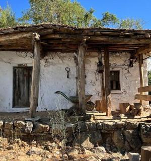 an old house with a wooden roof