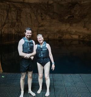 a man and a woman standing in a tunnel
