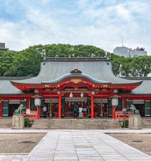 a temple in a park with a building