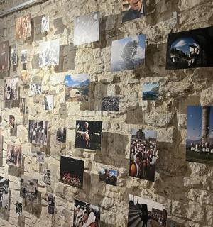 a stone wall with pictures on it