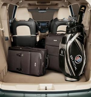 an open trunk of a car with luggage in it