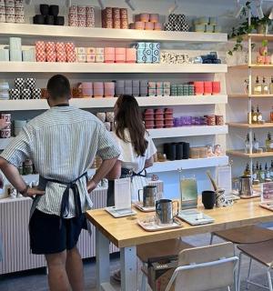 a group of people standing at a counter in a store
