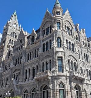 a large stone building with a clock tower on it