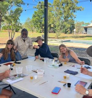 a group of people sitting around a table