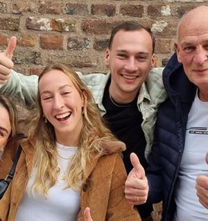 a group of three people giving thumbs up