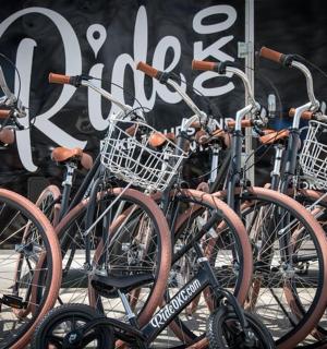 a group of bikes parked in front of a store