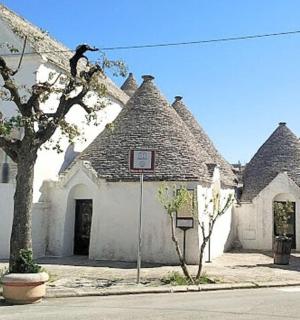 a row of white houses with roofs