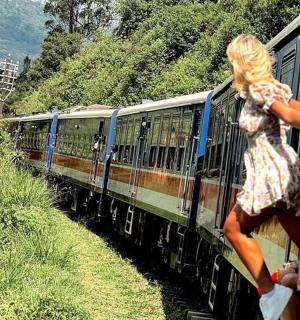 a woman is jumping out of a train