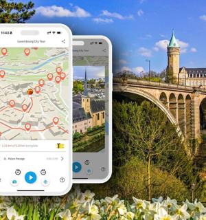 dwa iPhone'y obok zdjęcia mostu