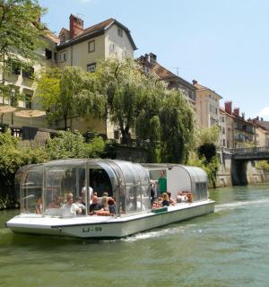 a group of people riding a boat on a river