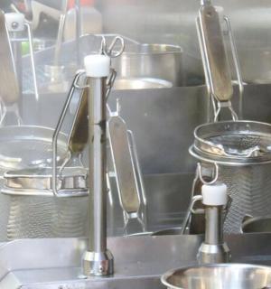 a kitchen with pots and pans and a sink