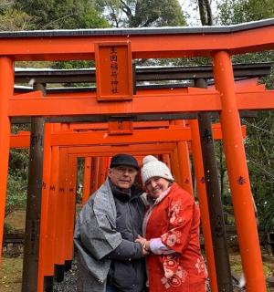 two people standing in front of an orange structure