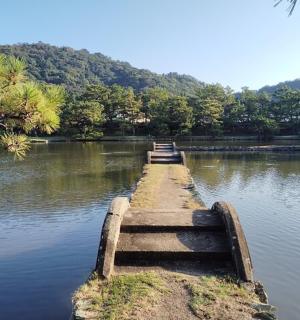 a small dock in the middle of a lake