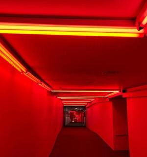 a red corridor with red lights in a tunnel