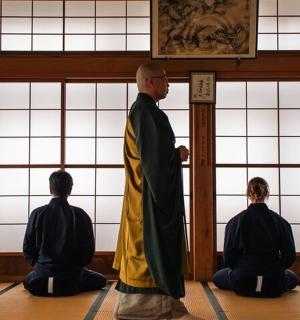 a group of people sitting on the floor in a room