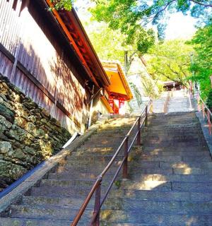 a set of stairs next to a stone building