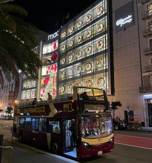 a double decker bus parked in front of a building