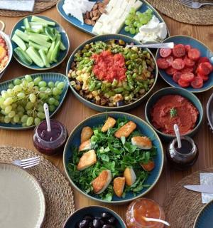 a table topped with bowls of different types of food