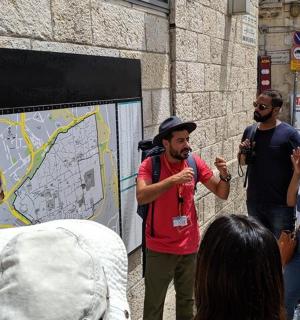 a group of people standing in front of a map