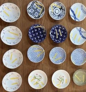 a group of blue and white plates on a table