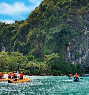 a group of people in boats in the water